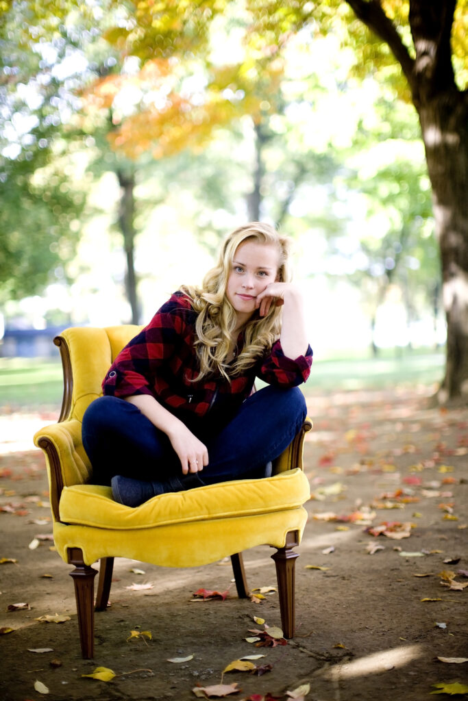 high school senior girl sitting on a gold chair in lititz springs park - amanda kraft photography to demonstrate how to craft the perfect blog post for photographers