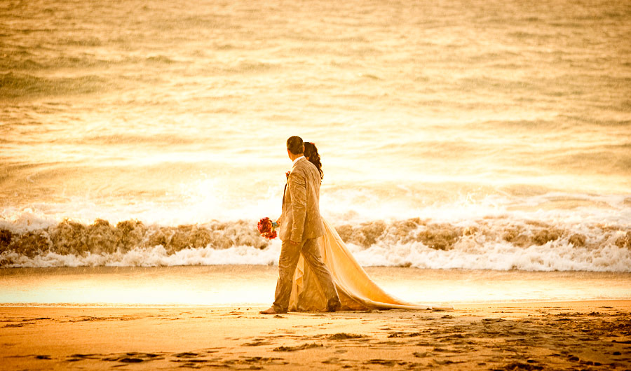 bride and groom walking on the beach in Mexico for blog post ideas for destination wedding and elopement photographers